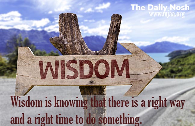 Wisdom,Wooden,Sign,With,A,Street,Background